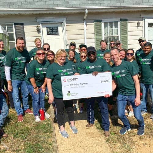 Crosby Team Members Present -5,000 Check to Rebuilding Together