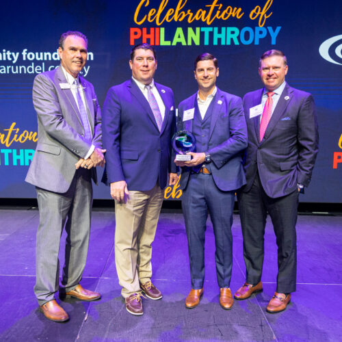 Terry Liff, Brad Walsh, Tom Simmons, and Jay Walsh accept the Liff, Walsh & Simmons and Eagle | Title, 2024 Celebration of Philanthropy - Corporate Philanthropists of the Year Award.